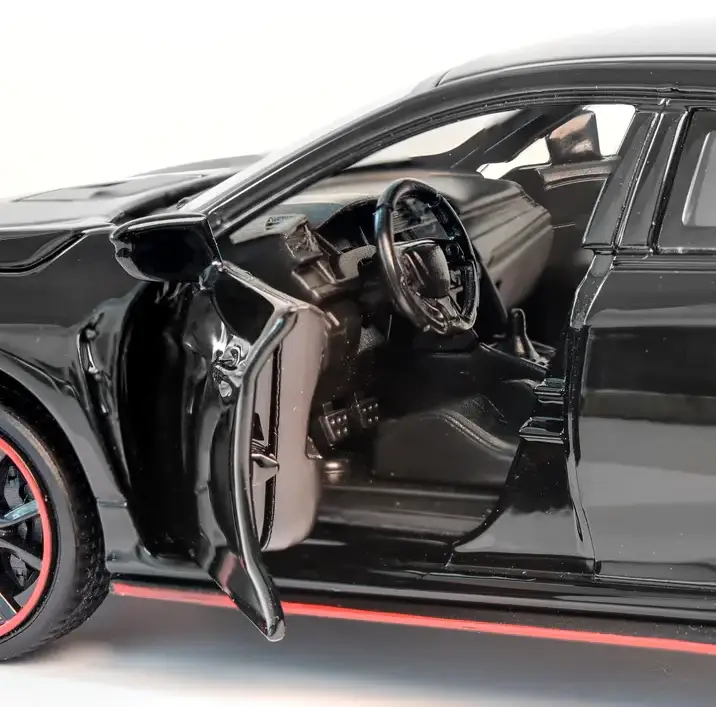 Black die-cast model of a dodge charger with red-accented wheels and open driver’s side door.