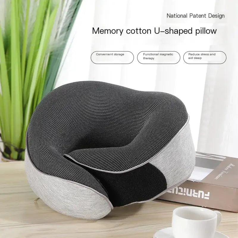 Black and gray memory cotton u-shaped pillow with a textured fabric cover.