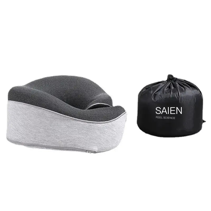 Gray and black memory foam travel pillow with a textured fabric cover, accompanied by its branded storage bag.