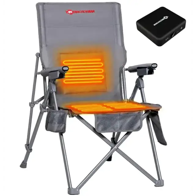 Gray foldable camping chair with integrated heating elements glowing orange on the backrest and seat, featuring a mesh storage pocket on each side.