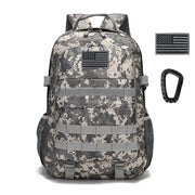 A tactical backpack with a digital camouflage pattern in shades of gray and beige, featuring multiple gray webbing straps and an american flag patch on the front.