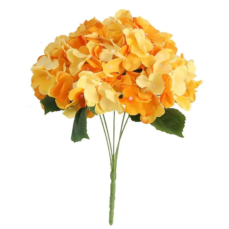 A vibrant bouquet of artificial hydrangeas in gradient shades of orange and yellow, featuring lush petals and green stems with leaves.