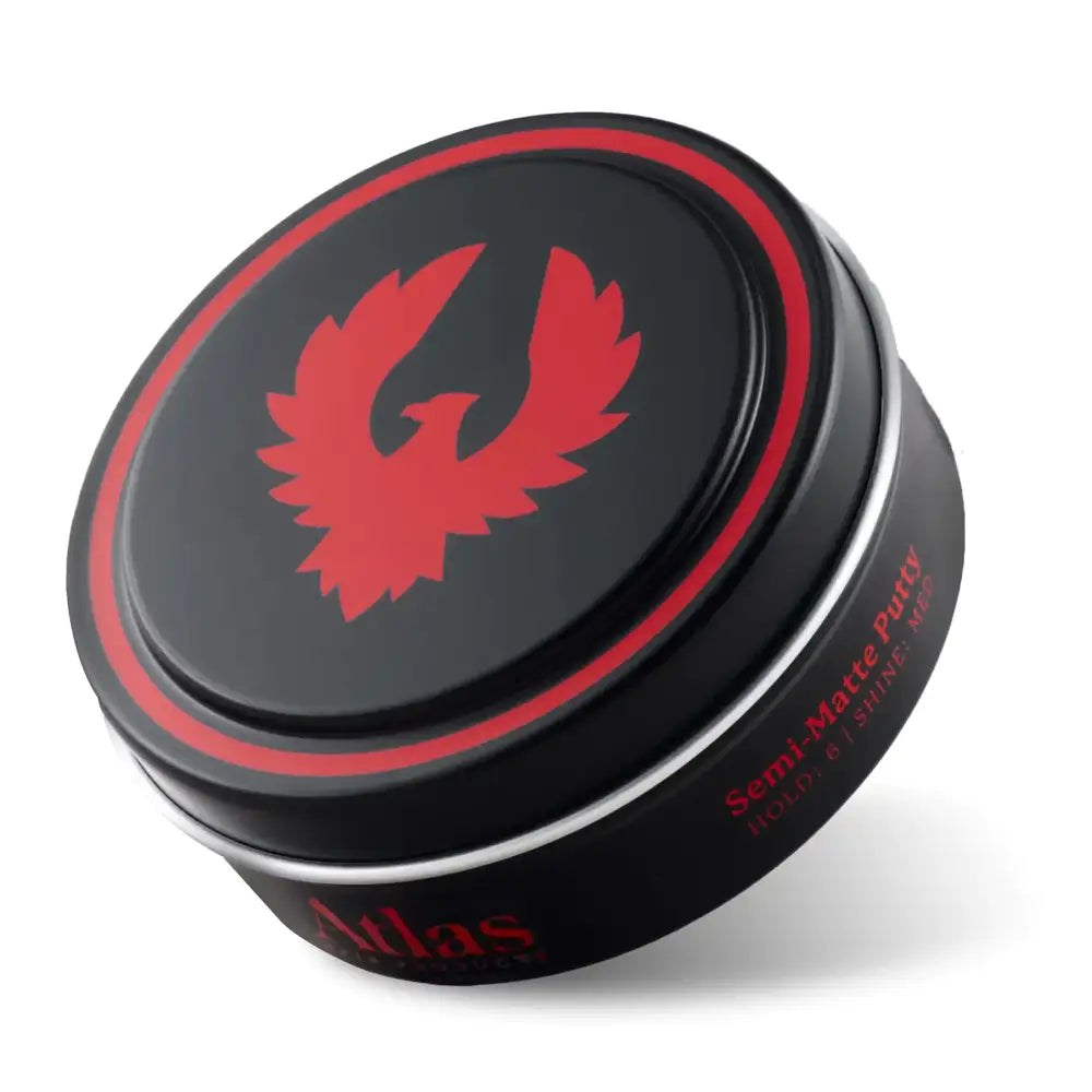 Black cylindrical tin with a red phoenix logo and silver rim, labeled ’atlas semi-matte putty.’