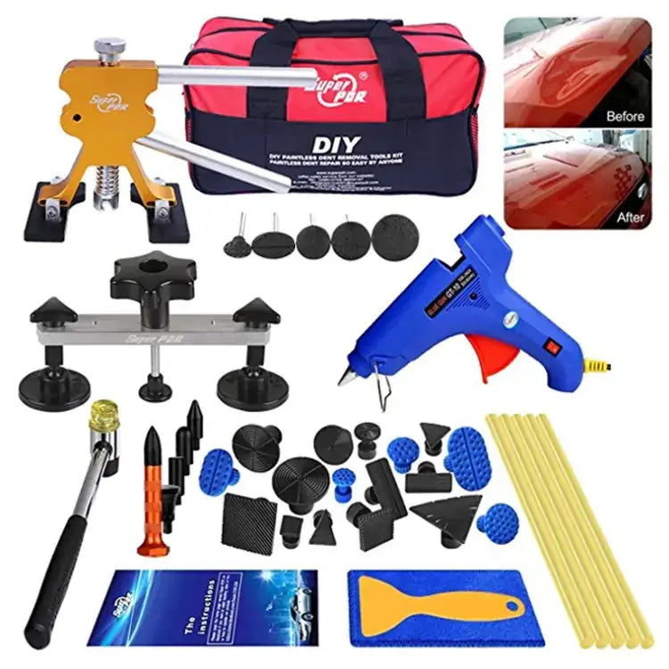 Orange and silver diy paintless dent repair tool kit with black suction cups, blue glue gun, and assorted plastic and rubber patches.