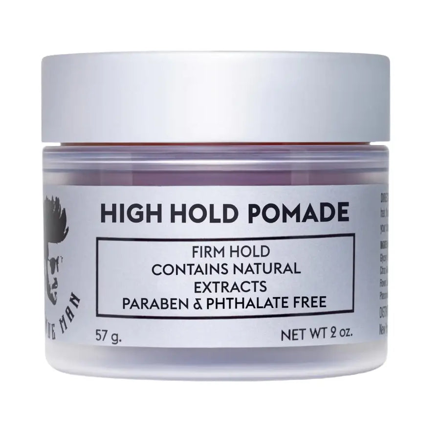 A sleek, translucent jar with a silver lid contains the ’high hold pomade’ by the man brand.