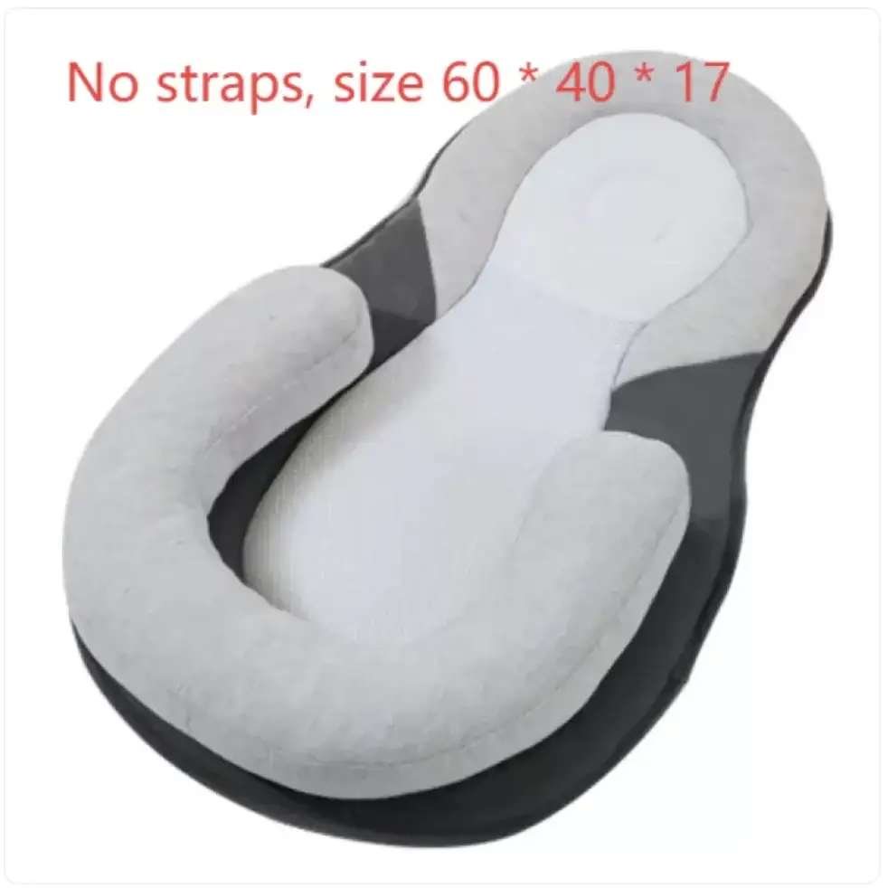 Gray and black baby sleep positioner with a contoured, cushioned design for safe infant positioning.