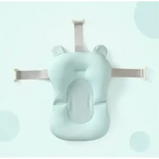 Light blue, soft silicone baby bath support with adjustable straps and ear-like protrusions.