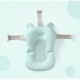 Light blue, soft silicone baby bath support with adjustable straps and ear-like protrusions.