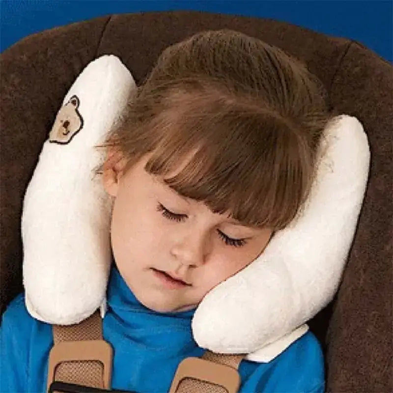 White plush neck pillow with embroidered bear face design.