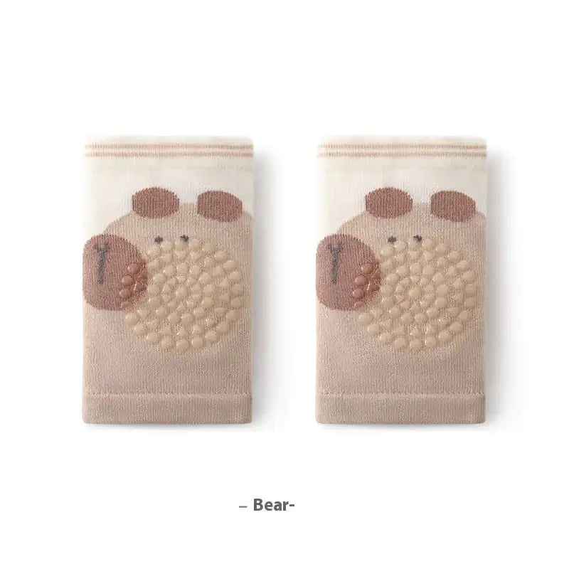 Beige knee-high socks featuring a cute bear face with textured brown patches and embroidered details.