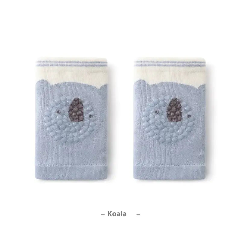 Light blue koala-themed knee-high socks with embroidered details and a cream-colored ribbed cuff.