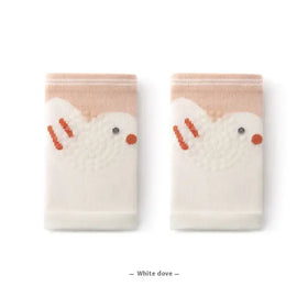 A pair of soft, cream-colored knit socks featuring embroidered white dove designs with orange beaks and feet.