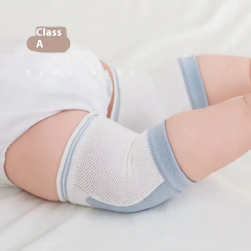 White and light blue mesh knee pads with soft elastic bands for baby wear.
