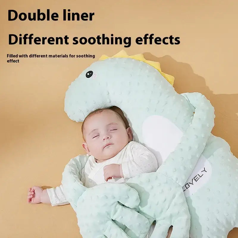 Light blue, plush dinosaur-shaped baby sleep sack with a yellow spiked back and white heart detail.