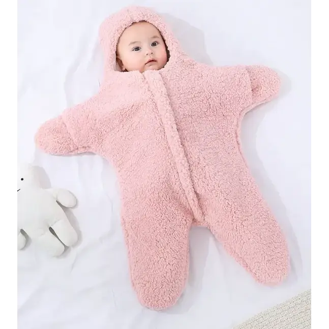 Pink star-shaped baby sleeper made of soft, plush fleece material.