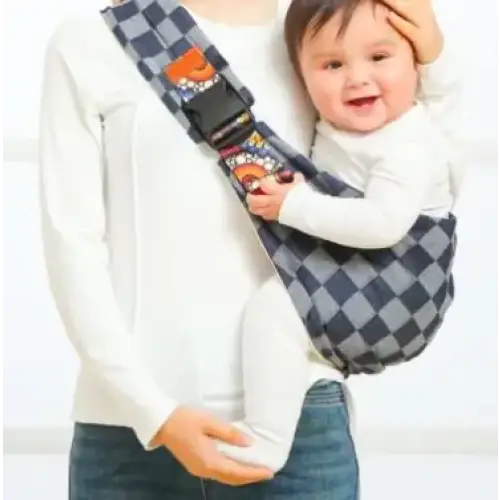 Blue and black checkered baby carrier with cartoon character patches.