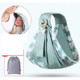 A soft mint-green baby sling with a leaf-patterned trim and wooden ring for secure carrying.