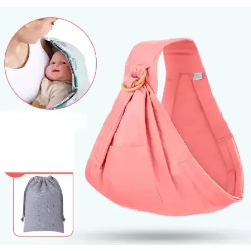 Pink cotton baby sling with a wooden ring and gray mesh storage pouch.