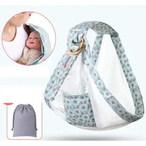 A soft, patterned baby carrier with a floral design in muted teal and white, featuring mesh panels for breathability.