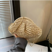 Beige woven straw handbag with a gold chain strap.