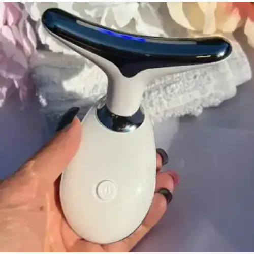 White and black facial massage device with a sleek, ergonomic design.