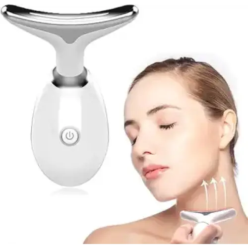 White and silver facial massage device with a sleek, ergonomic design.
