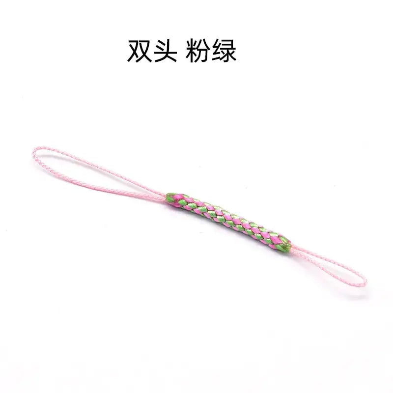 A pink and green braided phone strap with a double-ended design.