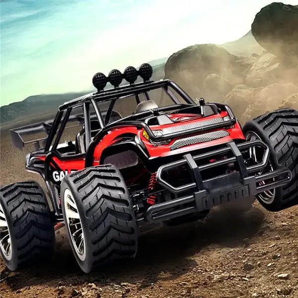 Red and black remote-controlled off-road monster truck with rugged tires, a reinforced front bumper, roof-mounted lights, and visible suspension components.