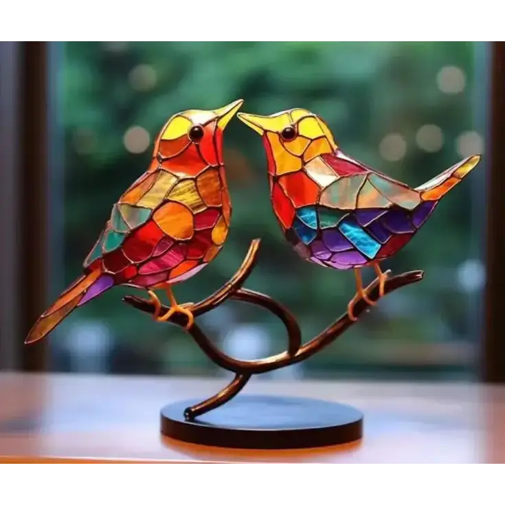 Vibrant stained glass birds perched on a curved branch, crafted with colorful mosaic panels and set upon a dark circular base.
