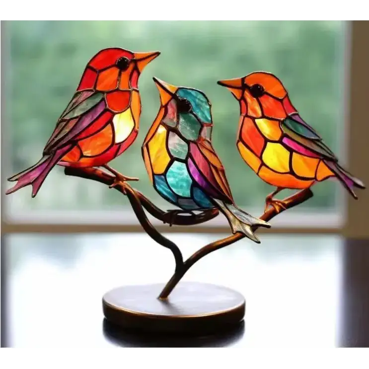 Vibrant stained glass bird lamp featuring three colorful birds perched on a branch, crafted with intricate leaded panels in shades of red, orange, yellow, blue, and purple.