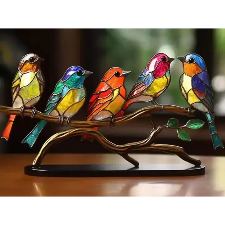 Vibrant stained glass bird figurines perched on a bronze branch, each featuring intricate colorful panels and detailed craftsmanship.