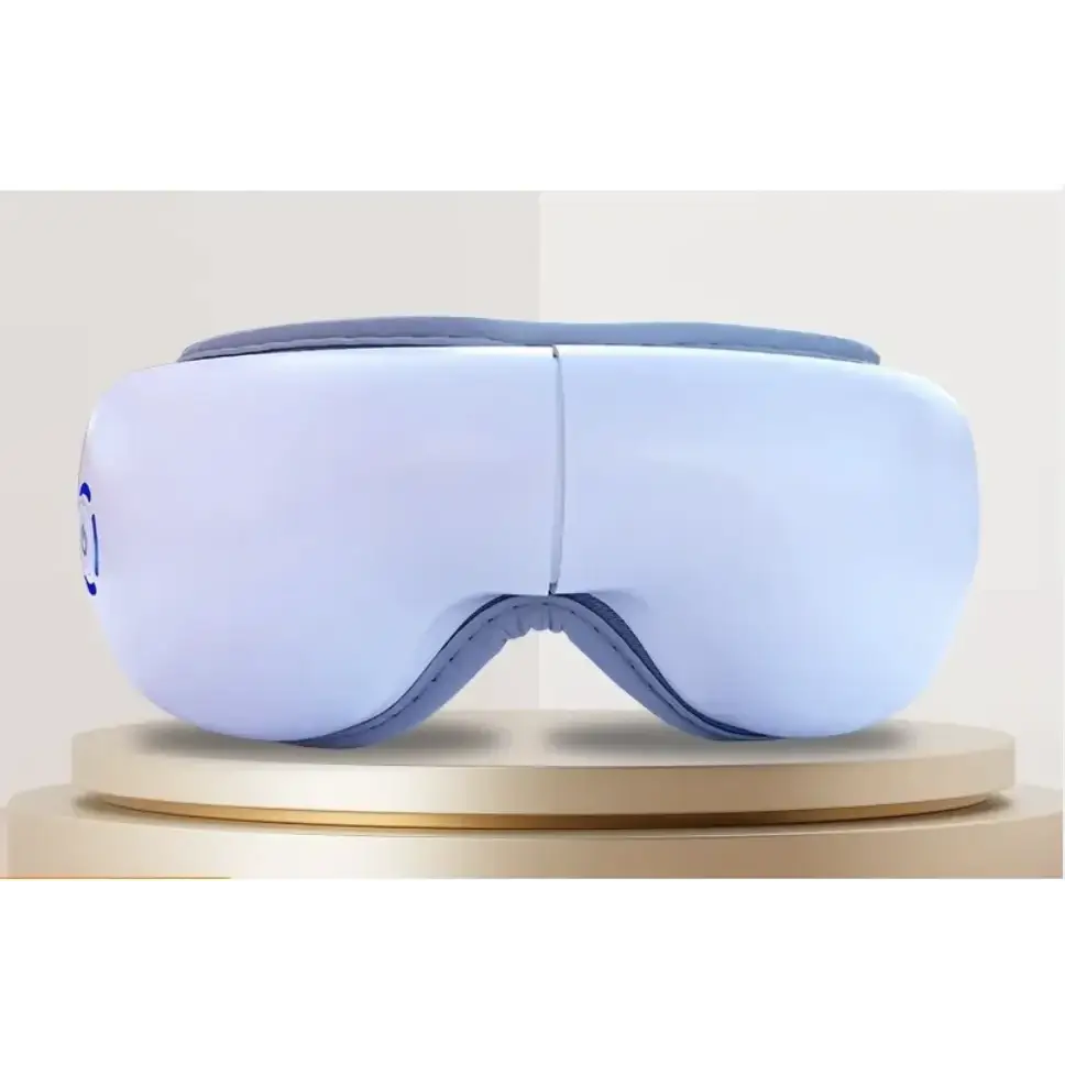 Light blue and gray eye massager with soft padded design.