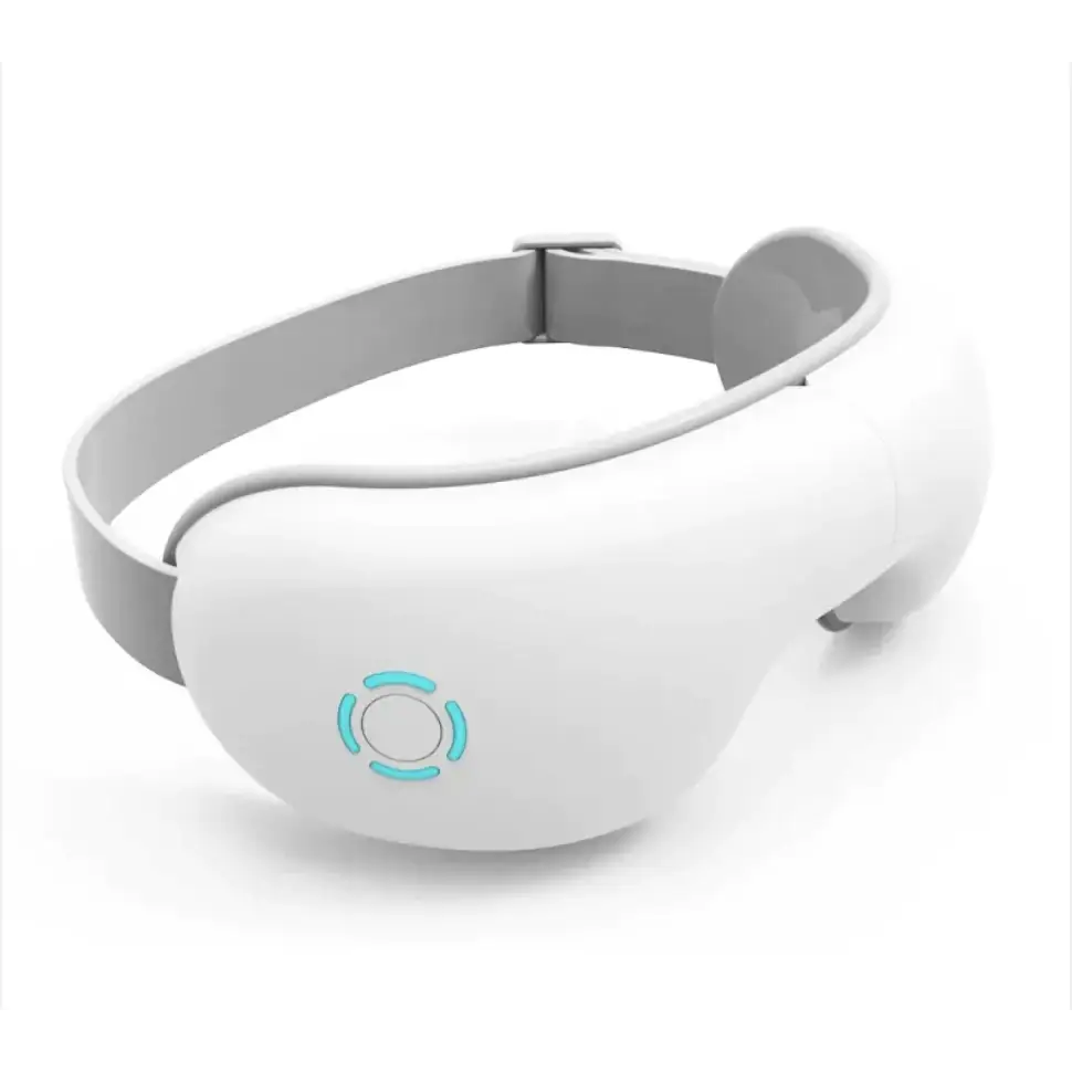 White and gray ergonomic eye massager with a glowing blue circular led indicator on the front.