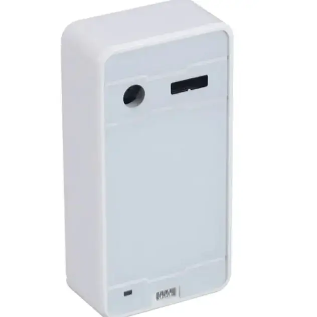 White rectangular plastic device with a circular hole and elongated slot on the front panel.