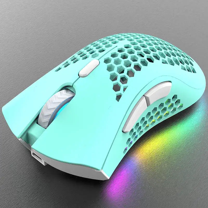A mint green gaming mouse with a honeycomb-patterned design and white accents, featuring rgb lighting that casts colorful reflections on the surface.