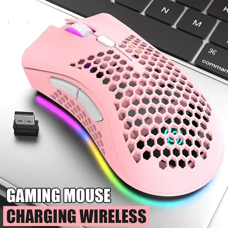 Pink wireless gaming mouse with a honeycomb-patterned design and rgb lighting.