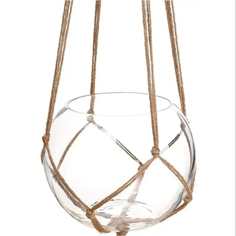 Clear glass spherical hanging planter suspended by natural-colored woven rope.