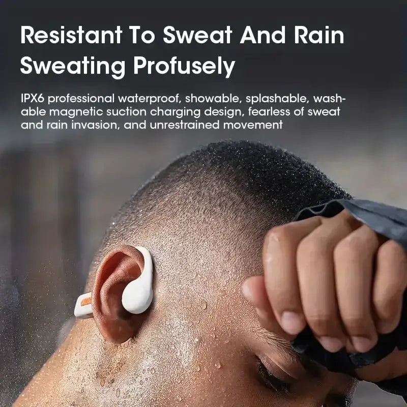 White wireless earbud with a sleek, ergonomic design and an orange accent on the charging case.