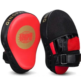 Red and black gingpak brand boxing focus mitts with a padded, textured surface for grip.