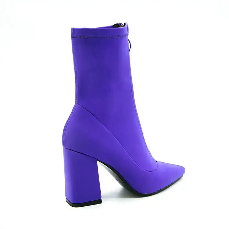 Vibrant purple ankle boot with a bold block heel and sleek, stretchy fabric upper.