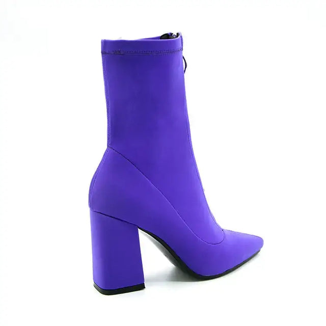 Vibrant purple ankle boot with a bold block heel and sleek, stretchy fabric upper.