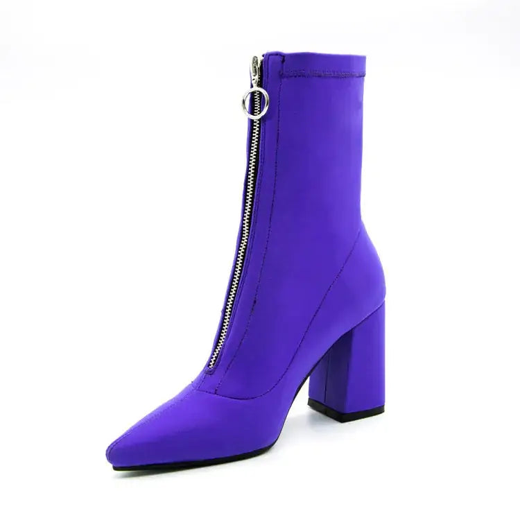 Vibrant purple ankle boot with a pointed toe, chunky block heel, and silver zipper pull.