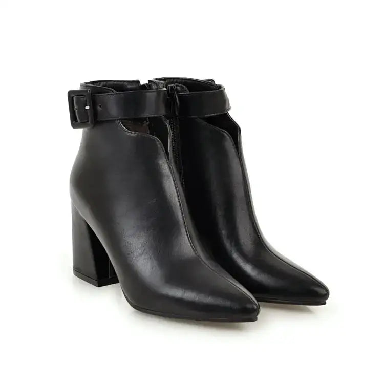 Black leather ankle boots with a block heel and buckle strap.