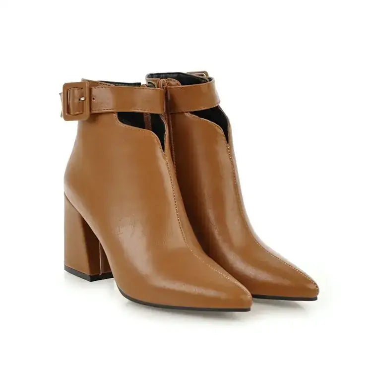 Tan leather ankle boots with a block heel and buckle strap.