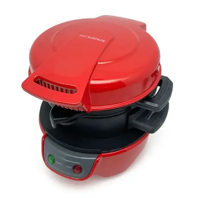 Red and black electric breakfast maker with a glossy finish, featuring a hinged lid marked ’hot surface’ and control buttons on the front panel.
