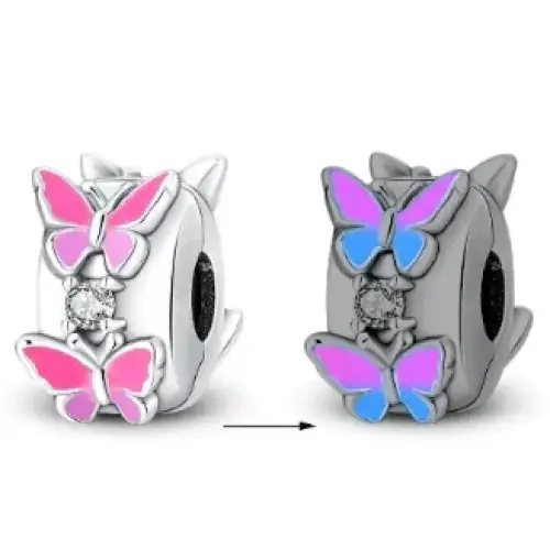 Silver butterfly charm with pink and blue enamel wings, featuring a central diamond accent.
