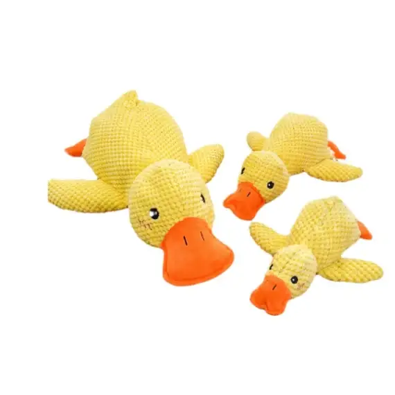 Yellow crocheted duck toys with orange beaks and feet.