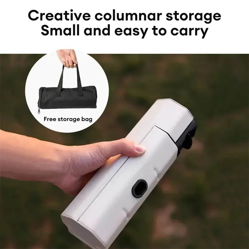White cylindrical portable storage case with black accents and a circular opening, shown being held in hand.