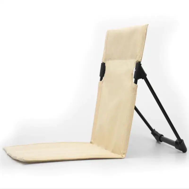 Beige fabric folding beach chair with black metal frame.