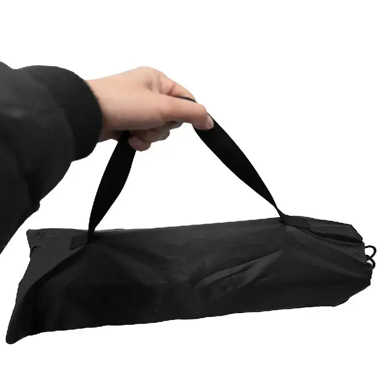 Black fabric carry bag with reinforced handles and drawstring closure.